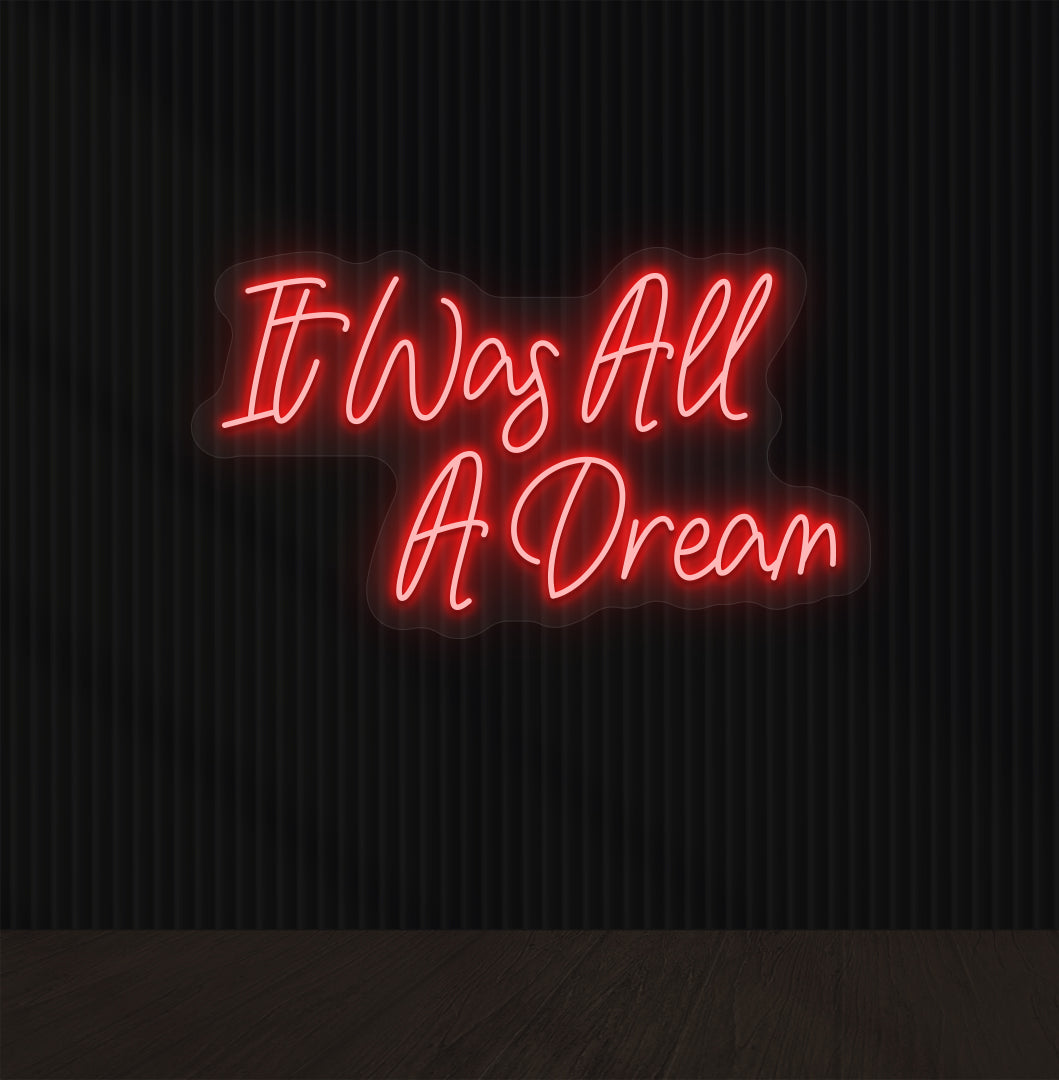 Image of an "it was all a dream" LED neon sign glowing on a dark wall in red color.
