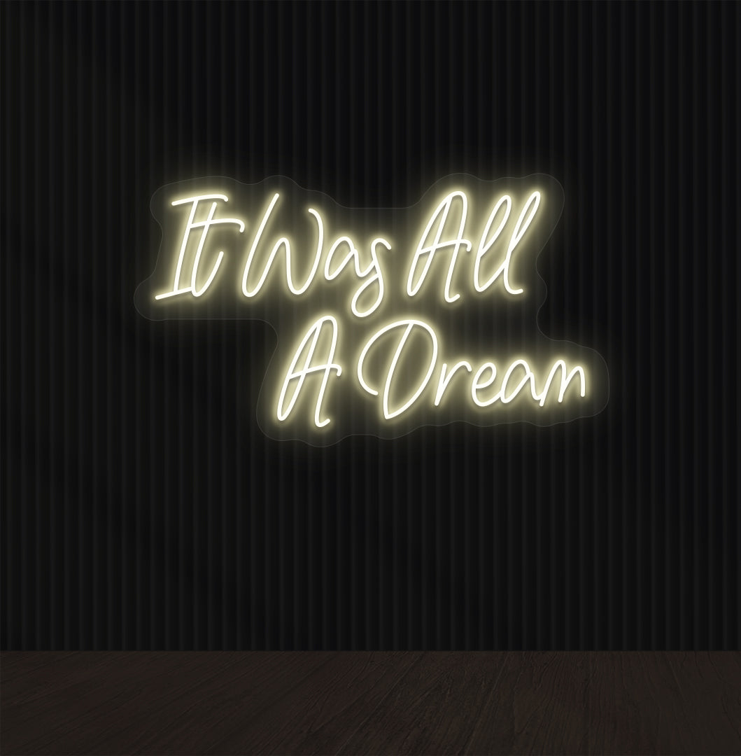 Stylish warm white LED "It was all a dream" neon sign mounted on dark wall. Perfect for bedrooms, gaming, creative studios, and aesthetic interiors.