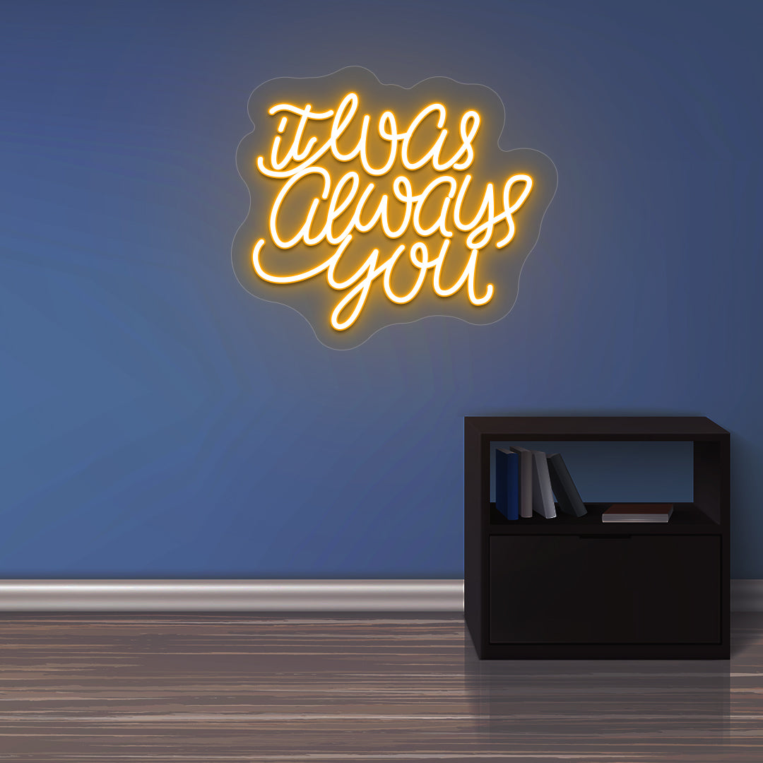 Aesthetic wall with "it was always you" orange LED neon sign. 