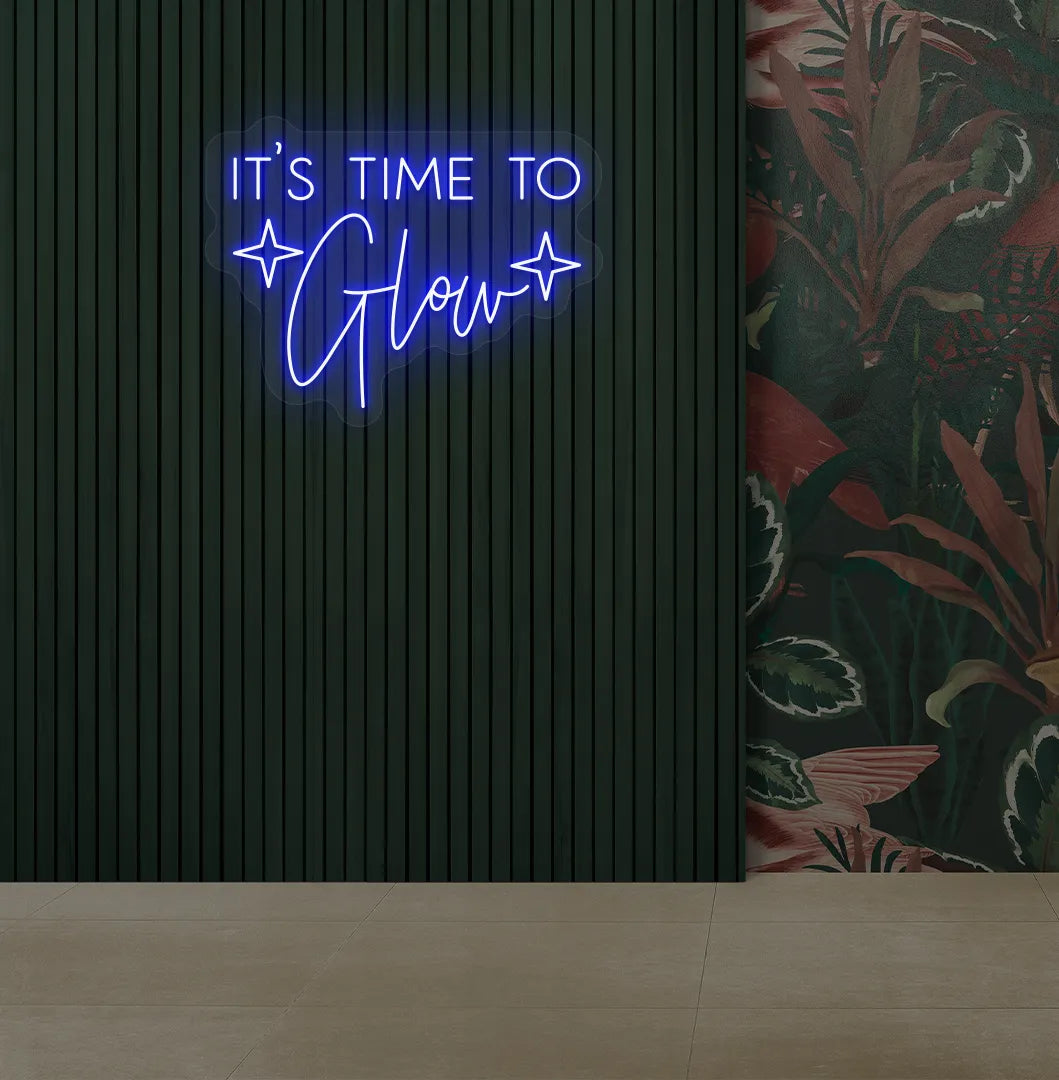 Image of an aesthetic salon wall with it’s time to glow neon sign glowing blue.