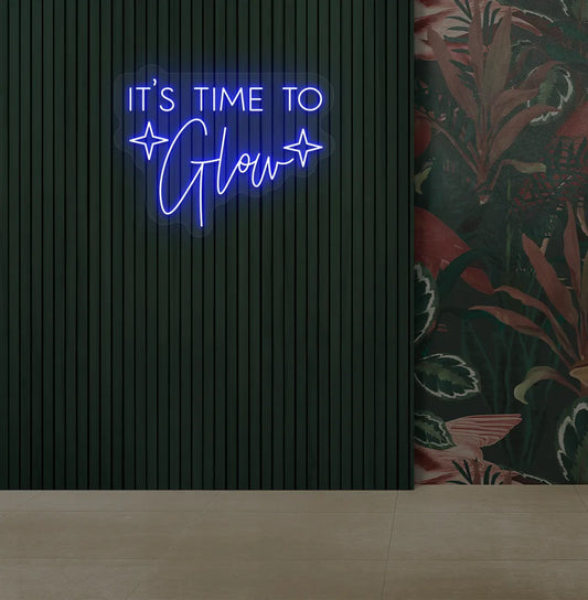 Image of an aesthetic salon wall with it’s time to glow neon sign glowing blue.