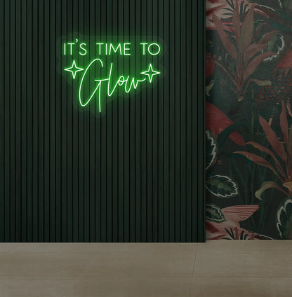 Modern salon aesthetic wall with it’s time to glow neon sign glowing green.
