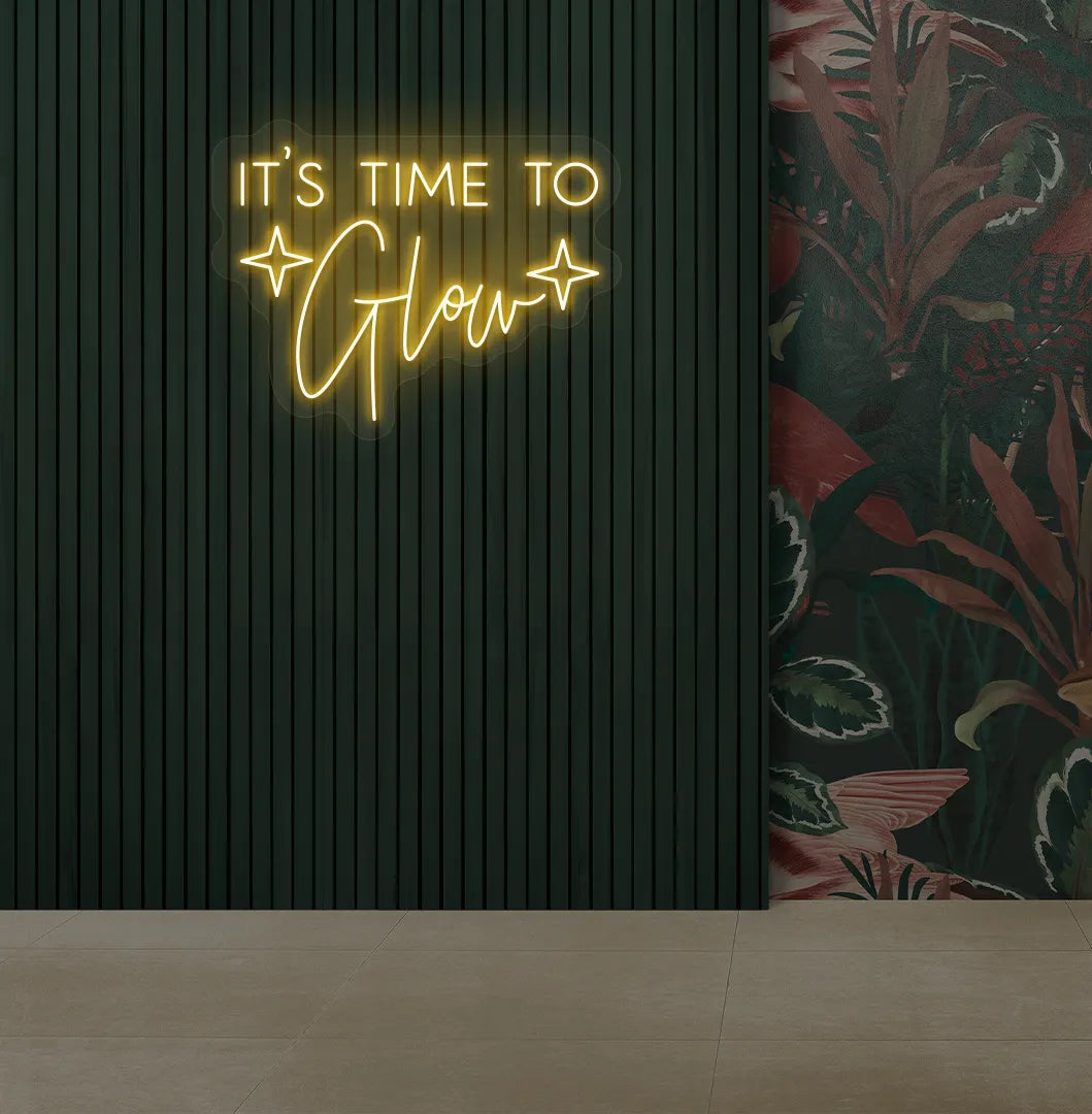 Modern salon aesthetic wall with it’s time to glow neon sign glowing orange.