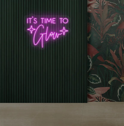 Image of an aesthetic salon wall with it’s time to glow neon sign glowing pink.