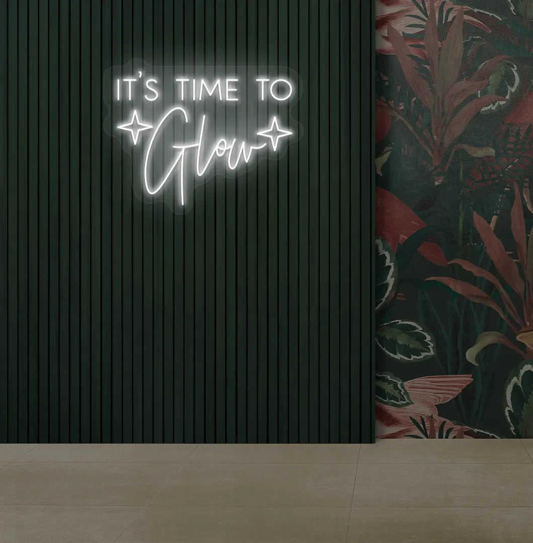 Image of an aesthetic salon wall with it’s time to glow neon sign glowing white.