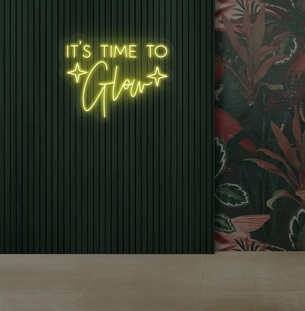 Modern salon aesthetic wall with it’s time to glow neon sign glowing yellow.