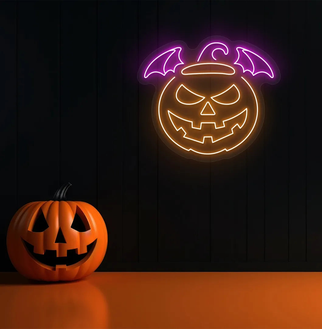 Pink Jack O' Lantern Neon Sign glowing on a spooky Halloween themed wall.