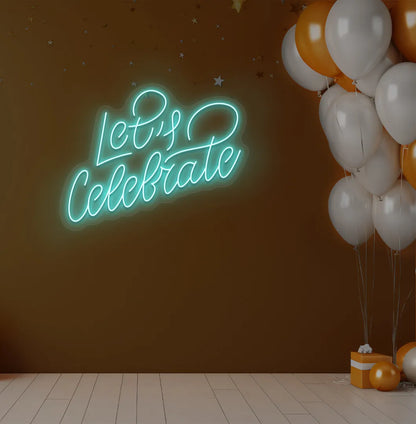 Party-themed Let's Celebrate neon sign mounted on modern event wall in ice blue color.