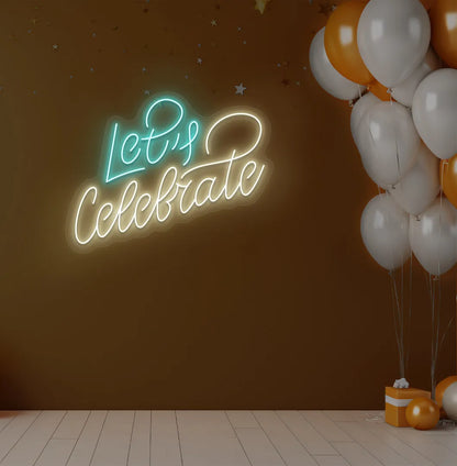 Image of a stylish Let's Celebrate LED neon sign mounted on aesthetic wall in warm white color.
