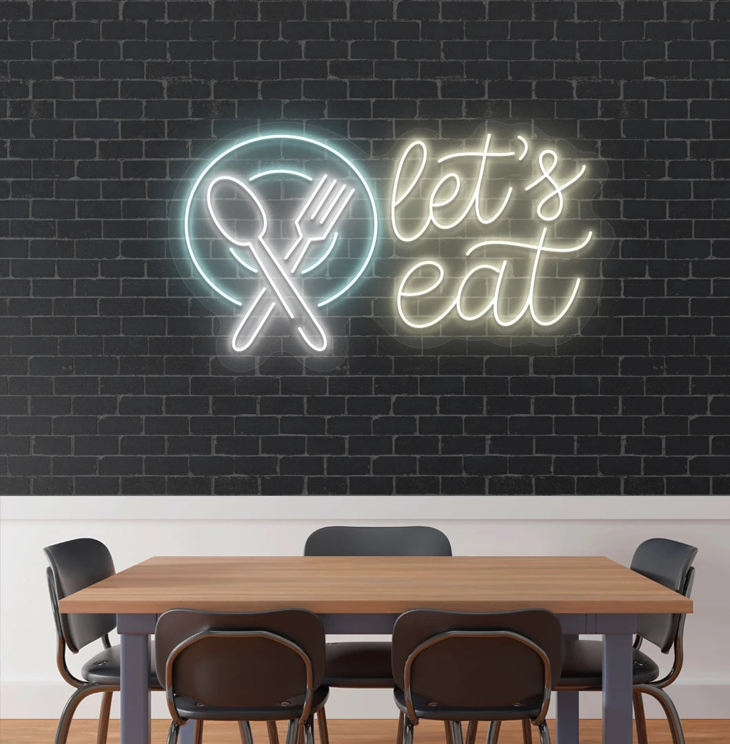 Let’s eat neon sign with a plate and crossed cutlery icon in warm white cafe interior.