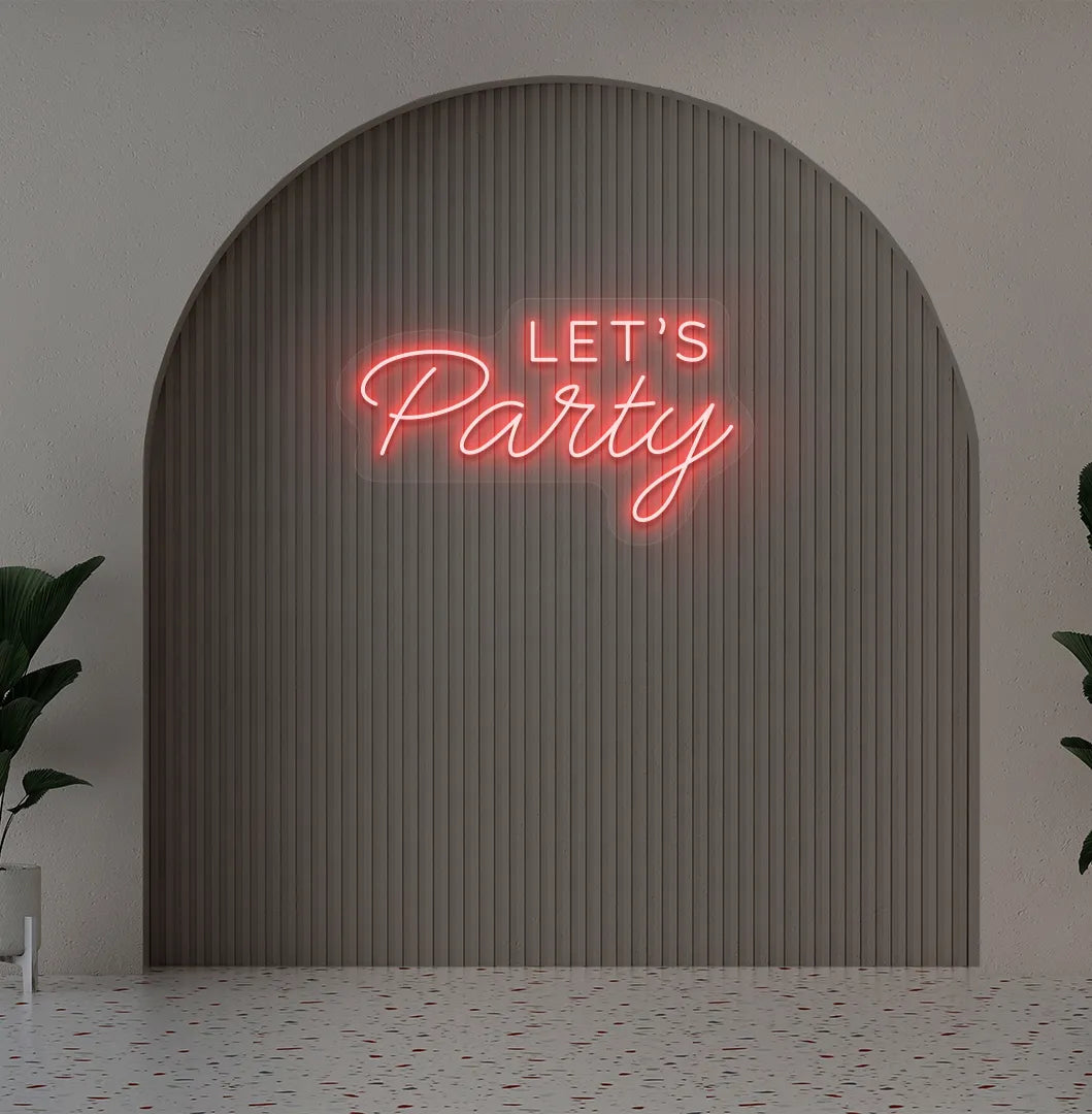 Party-themed Let's Party neon sign mounted on modern event wall in red color.