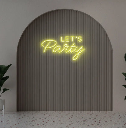 Image of a festive Let's Party yellow neon sign glowing on decorative wall.