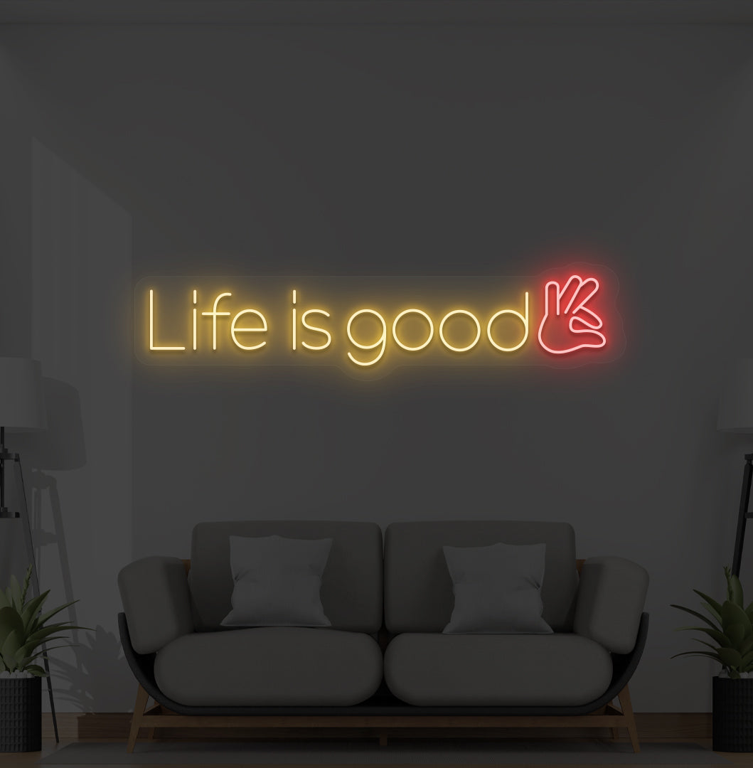 Aesthetic wall with "life is good" neon sign glowing orange.