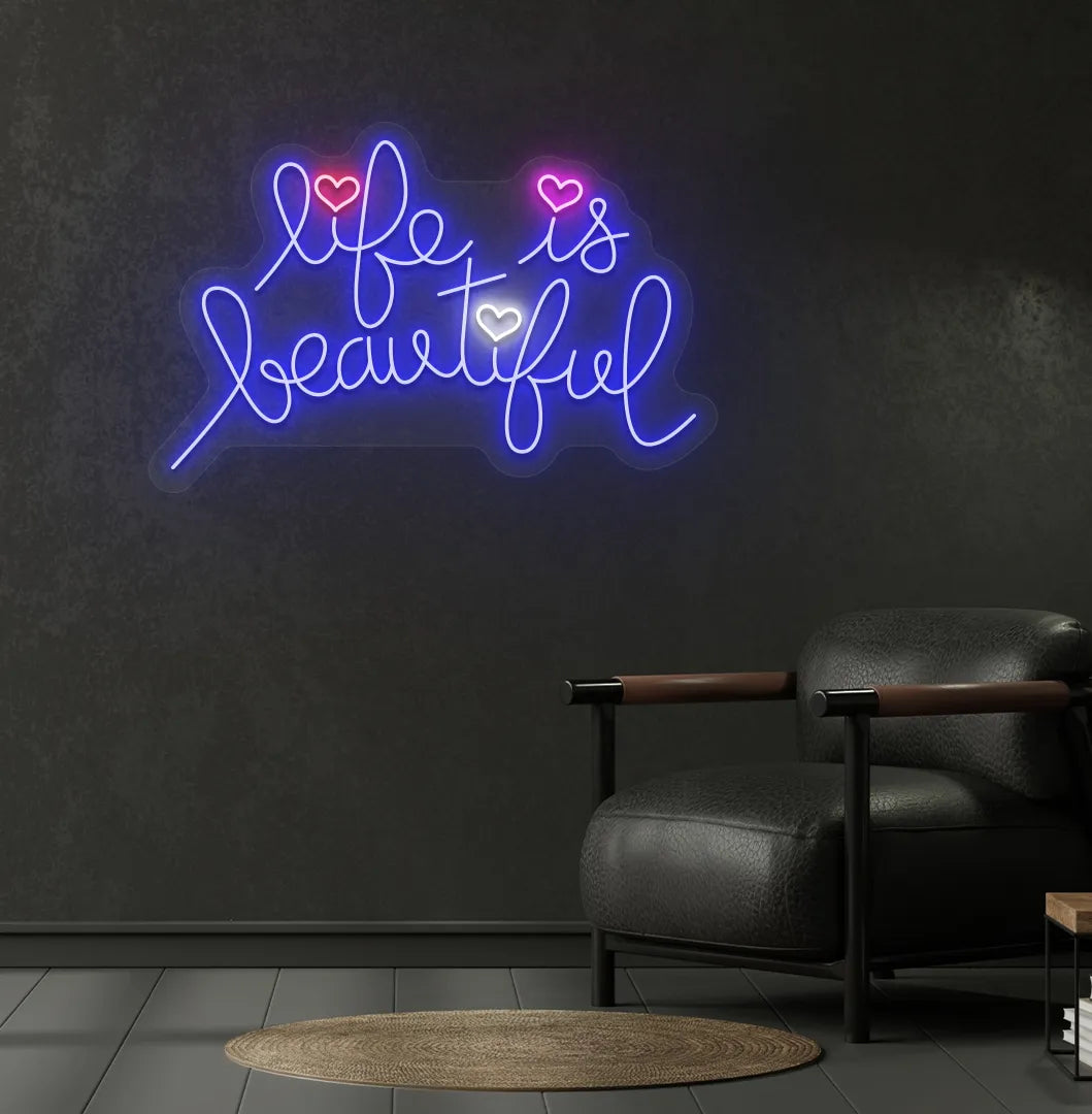Inspirational Life Is Beautiful neon sign glowing blue on aesthetic wall.