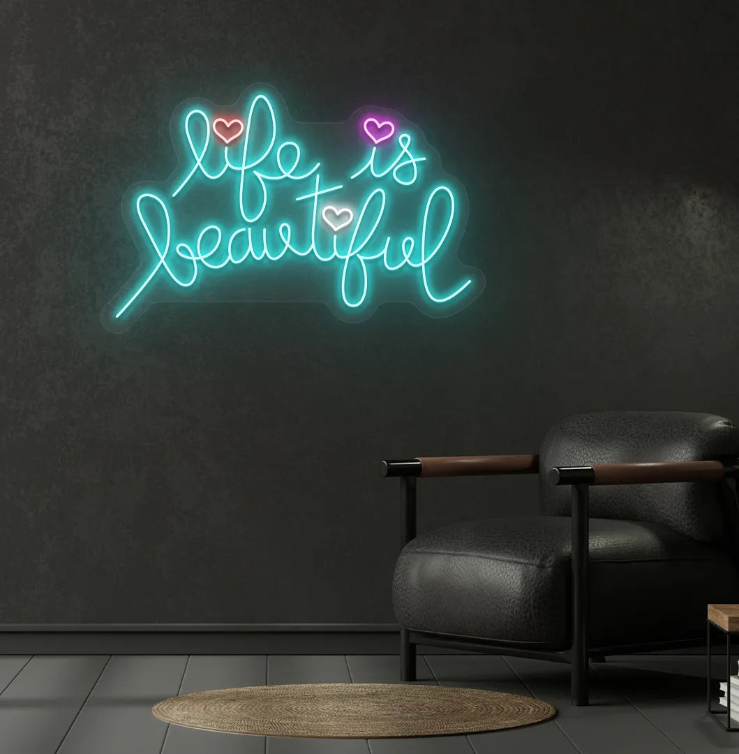 Inspirational Life Is Beautiful neon sign glowing ice blue on aesthetic wall.