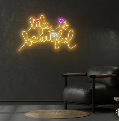 Trendy Life Is Beautiful neon sign mounted on aesthetic bedroom wall in orange color.