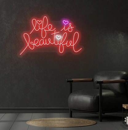 Inspirational Life Is Beautiful neon sign glowing red on aesthetic wall.