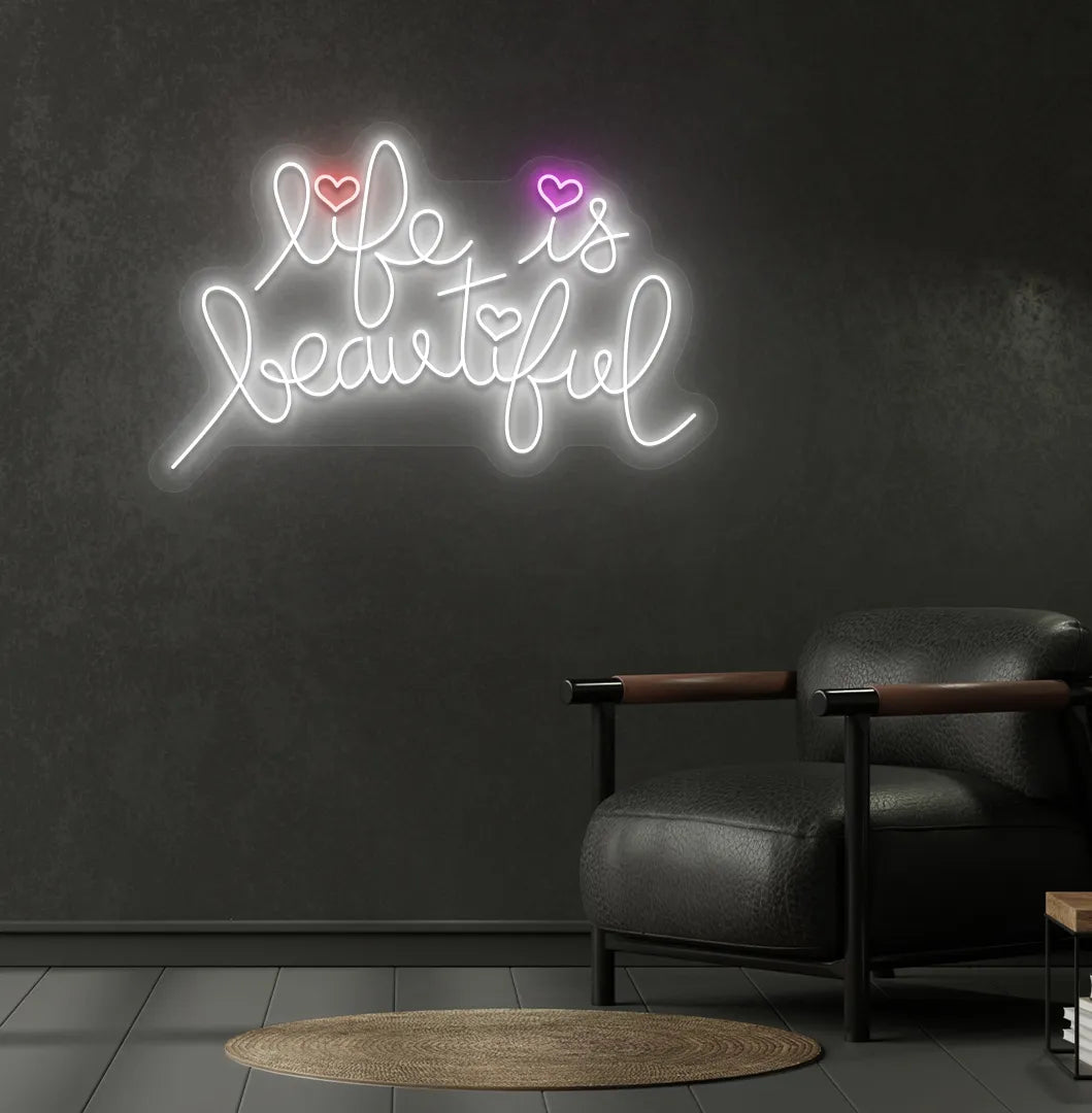 Inspirational Life Is Beautiful neon sign glowing white on aesthetic wall.