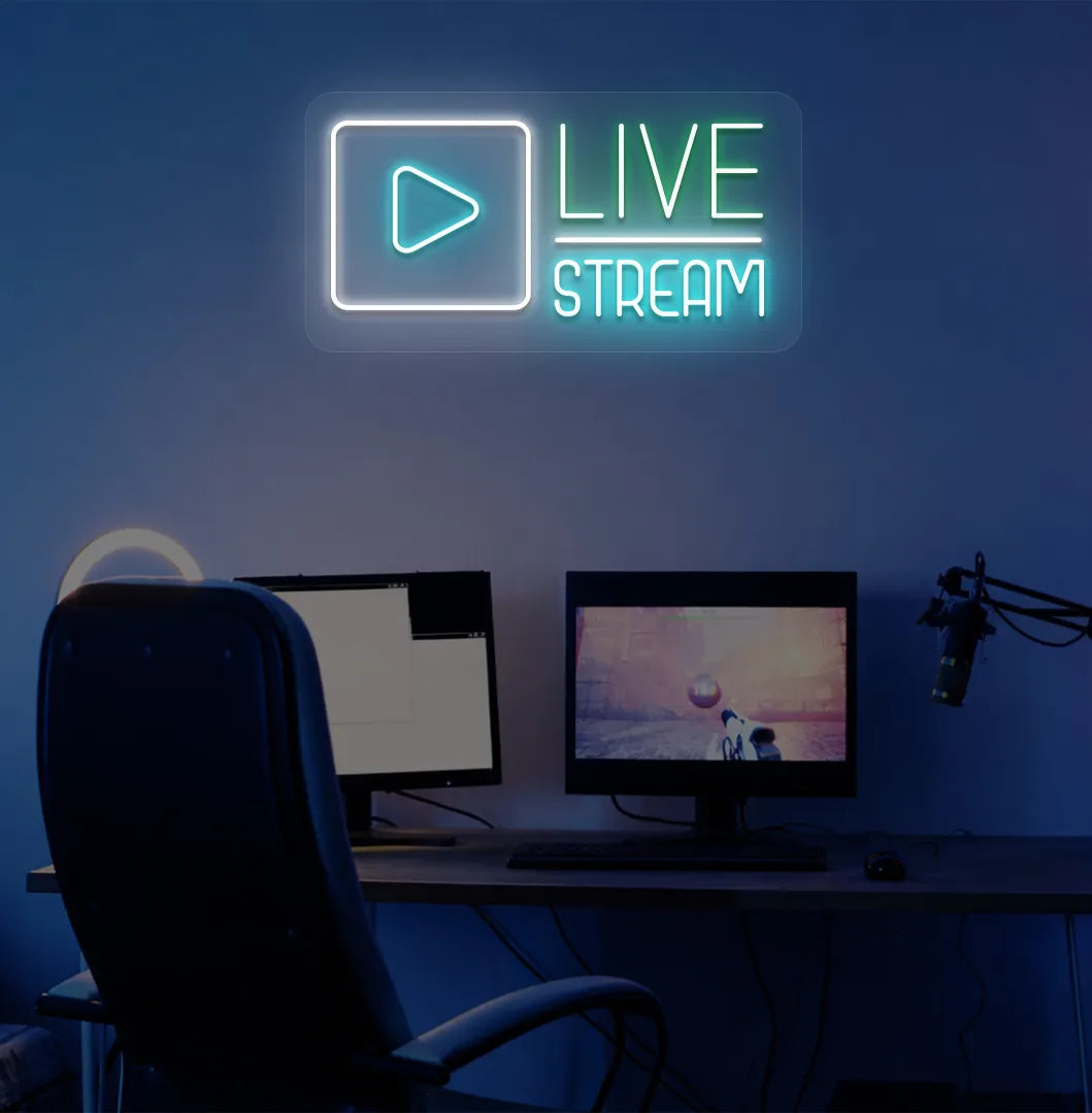 Stylish live stream neon sign in green mounted on gaming room wall.