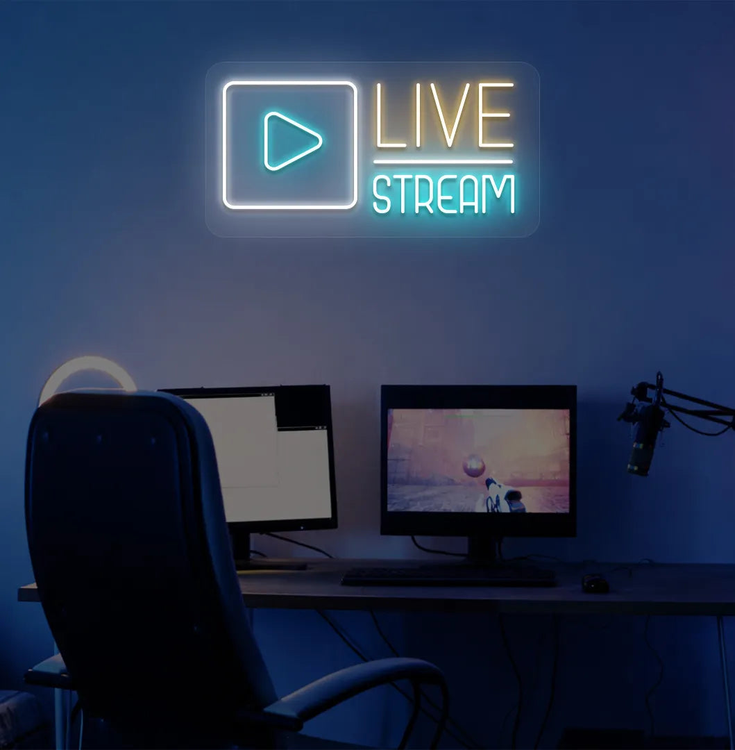 Stylish live stream neon sign in orange mounted on gaming room wall.