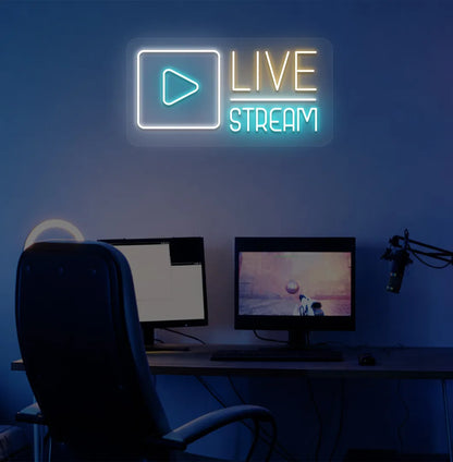 Stylish live stream neon sign in orange mounted on gaming room wall.