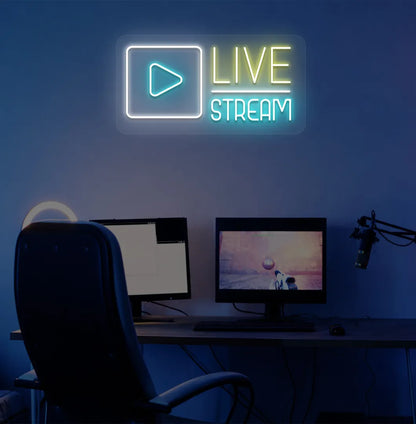 Stylish live stream neon sign in yellow mounted on gaming room wall.