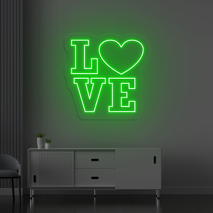 Romantic green LED love neon sign glowing on a wall.