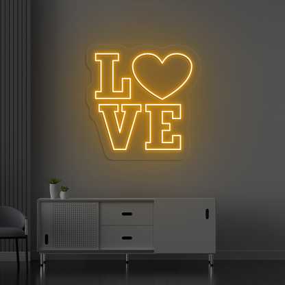 Romantic orange LED love neon sign glowing on a wall.