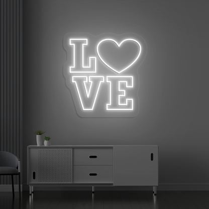 Image of a love neon sign glowing on a wall in white color.