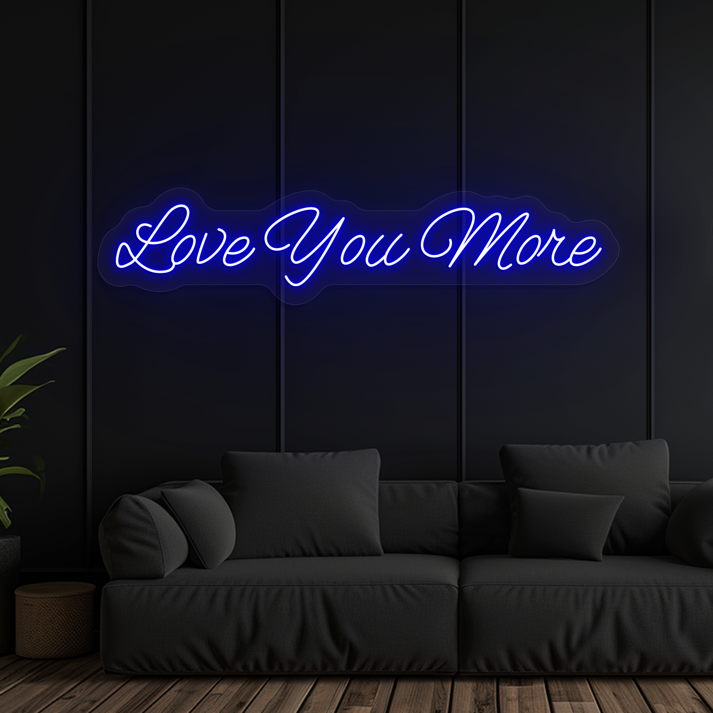Image of a "love you more" LED neon sign glowing on wall in blue color.