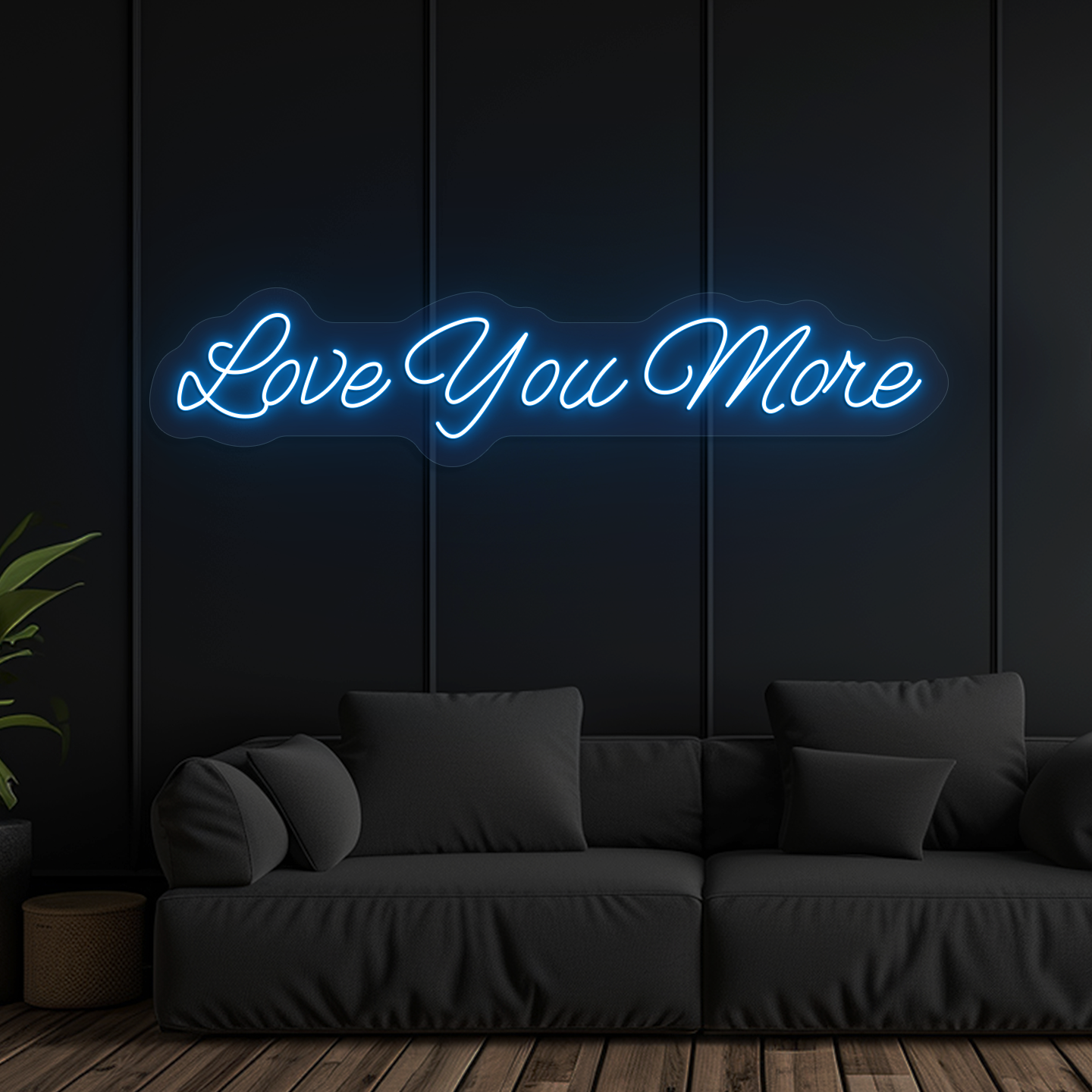 Image of a "love you more" LED neon sign glowing on wall in ice blue color.