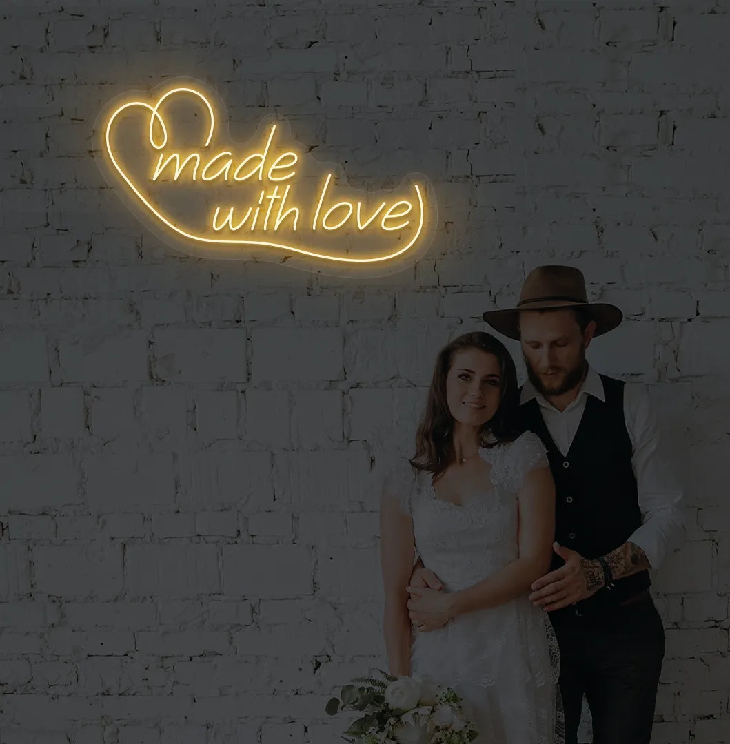 Bright orange made with Love neon sign for wedding backdrop decoration.
