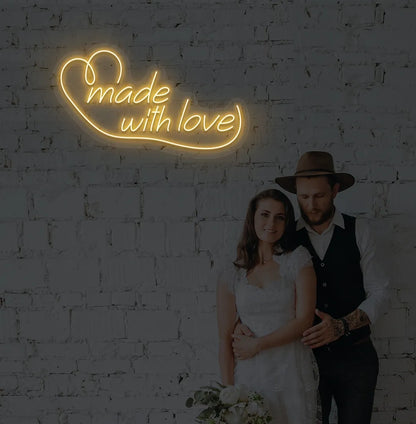 Bright orange made with Love neon sign for wedding backdrop decoration.