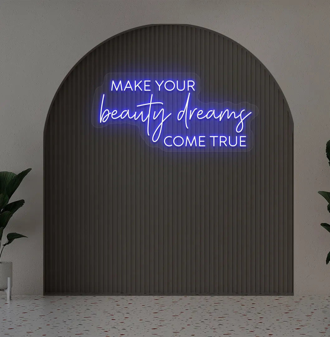 Image of a "Make your beauty dreams come true" neon sign in blue color on salon wall decor.