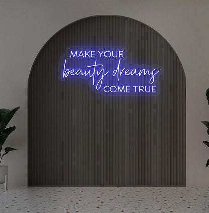 Image of a "Make your beauty dreams come true" neon sign in blue color on salon wall decor.
