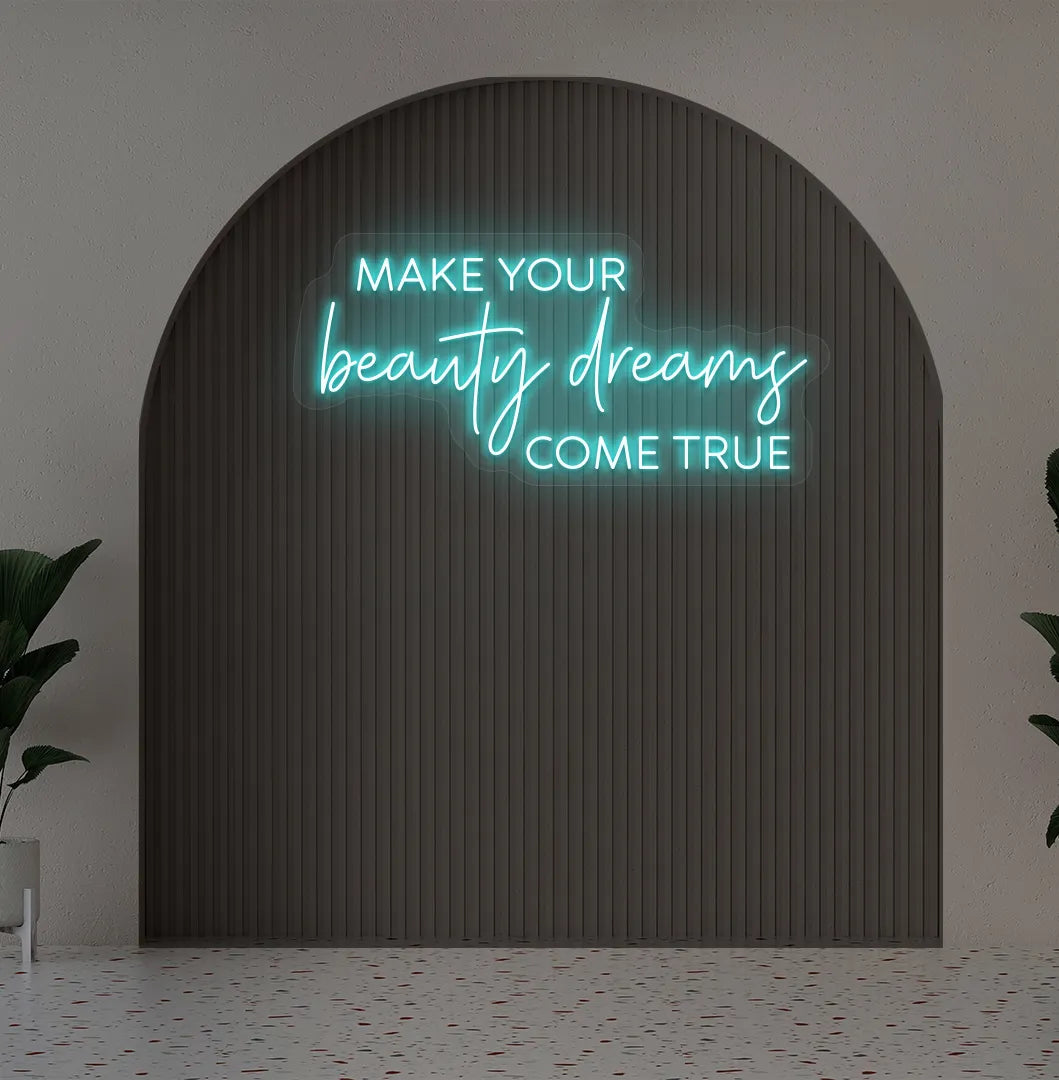 Image of a "Make your beauty dreams come true" neon sign in ice blue color on salon wall decor.