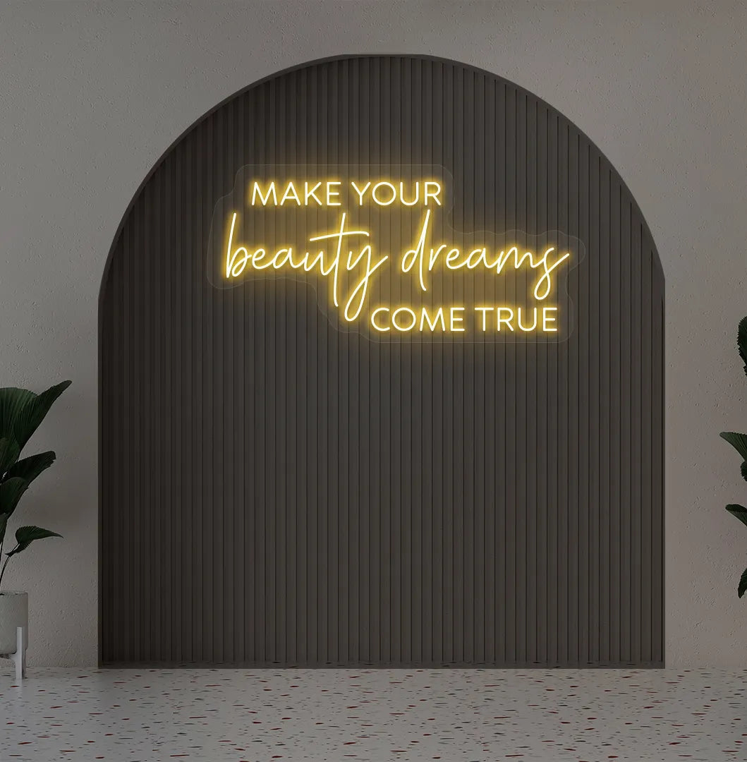 Orange "make your beauty dreams come true" LED neon sign for beauty studio setup.