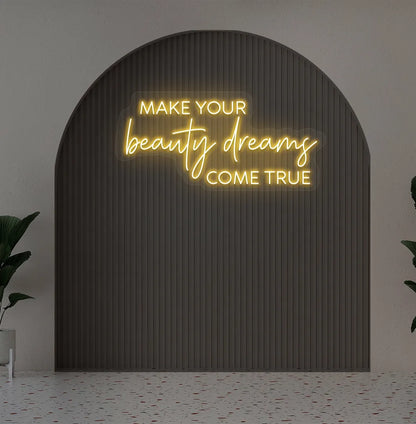 Orange "make your beauty dreams come true" LED neon sign for beauty studio setup.