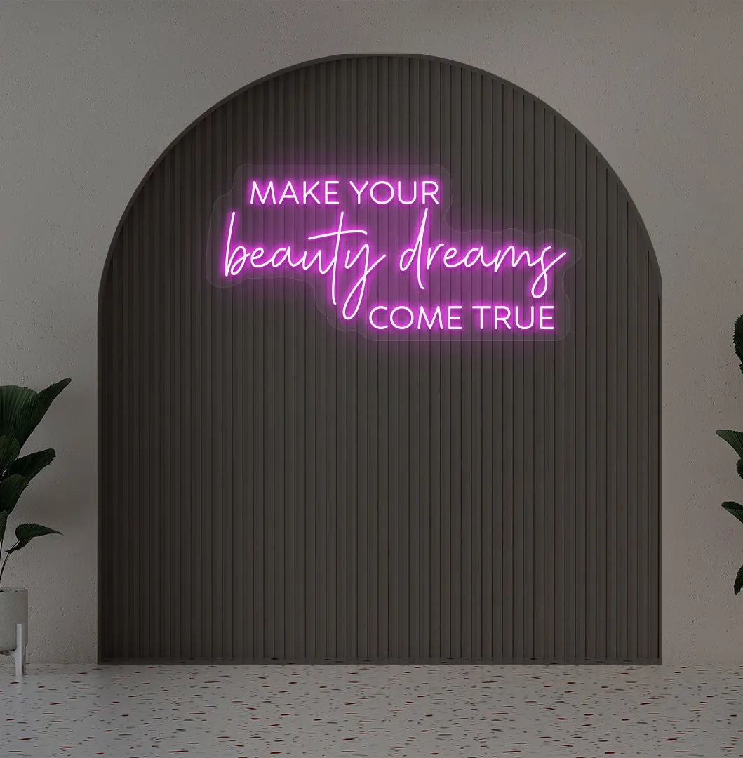 Image of a "Make your beauty dreams come true" neon sign in pink color on salon wall decor.