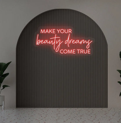 Image of a "Make your beauty dreams come true" neon sign in red color on salon wall decor.