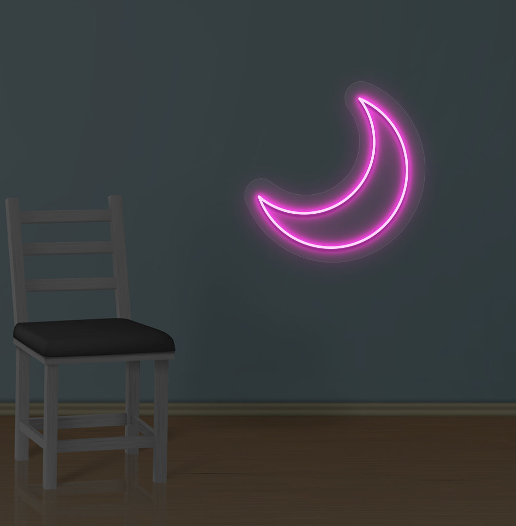 Image of a moon LED neon sign glowing on a wall in pink color.