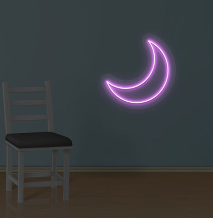 Dreamy wall decor with a moon LED neon sign glowing pink.