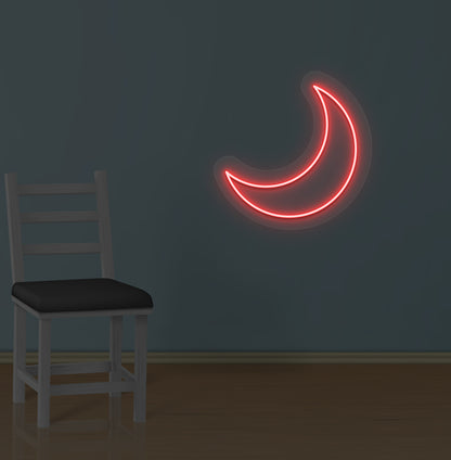 Image of a moon LED neon sign glowing on a wall in red color.