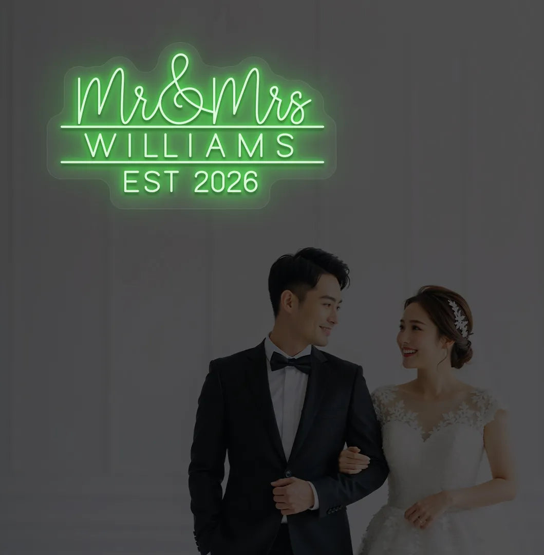 Green Mr and Mrs personalized wedding LED neon sign glowing on decorative wall.