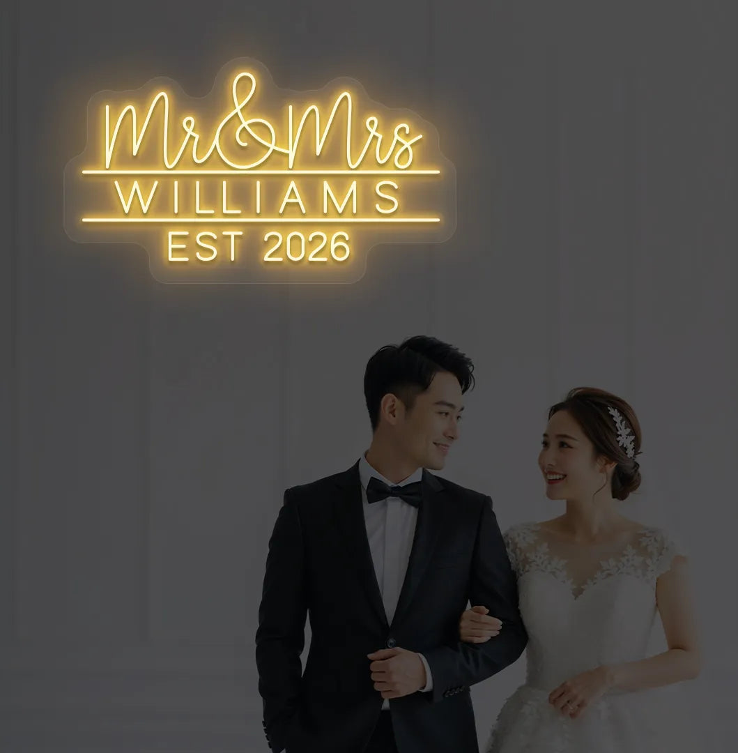 Orange Mr and Mrs personalized wedding LED neon sign glowing on decorative wall.