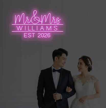 Purple Mr and Mrs personalized wedding LED neon sign glowing on decorative wall.
