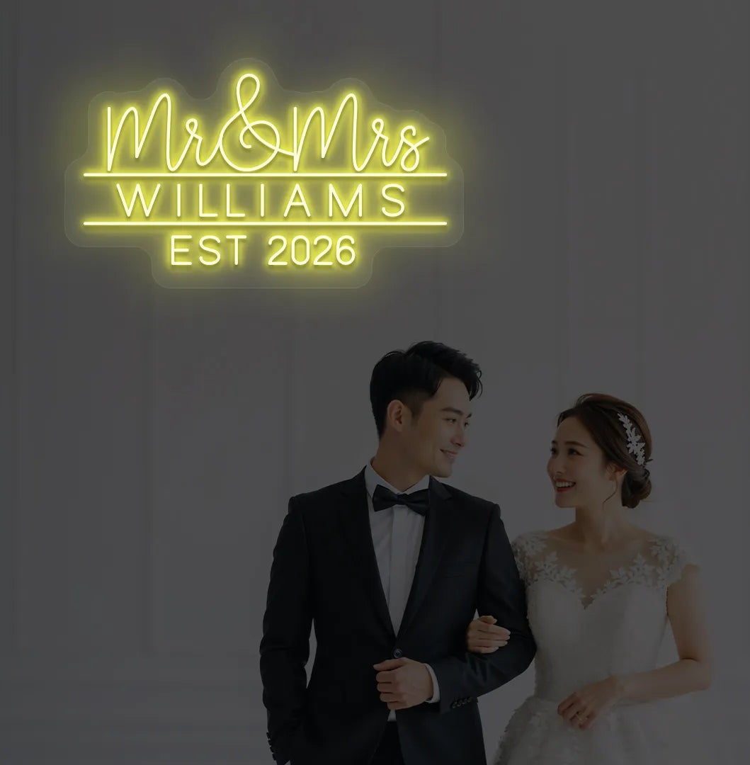 Yellow Mr and Mrs personalized wedding LED neon sign glowing on decorative wall.