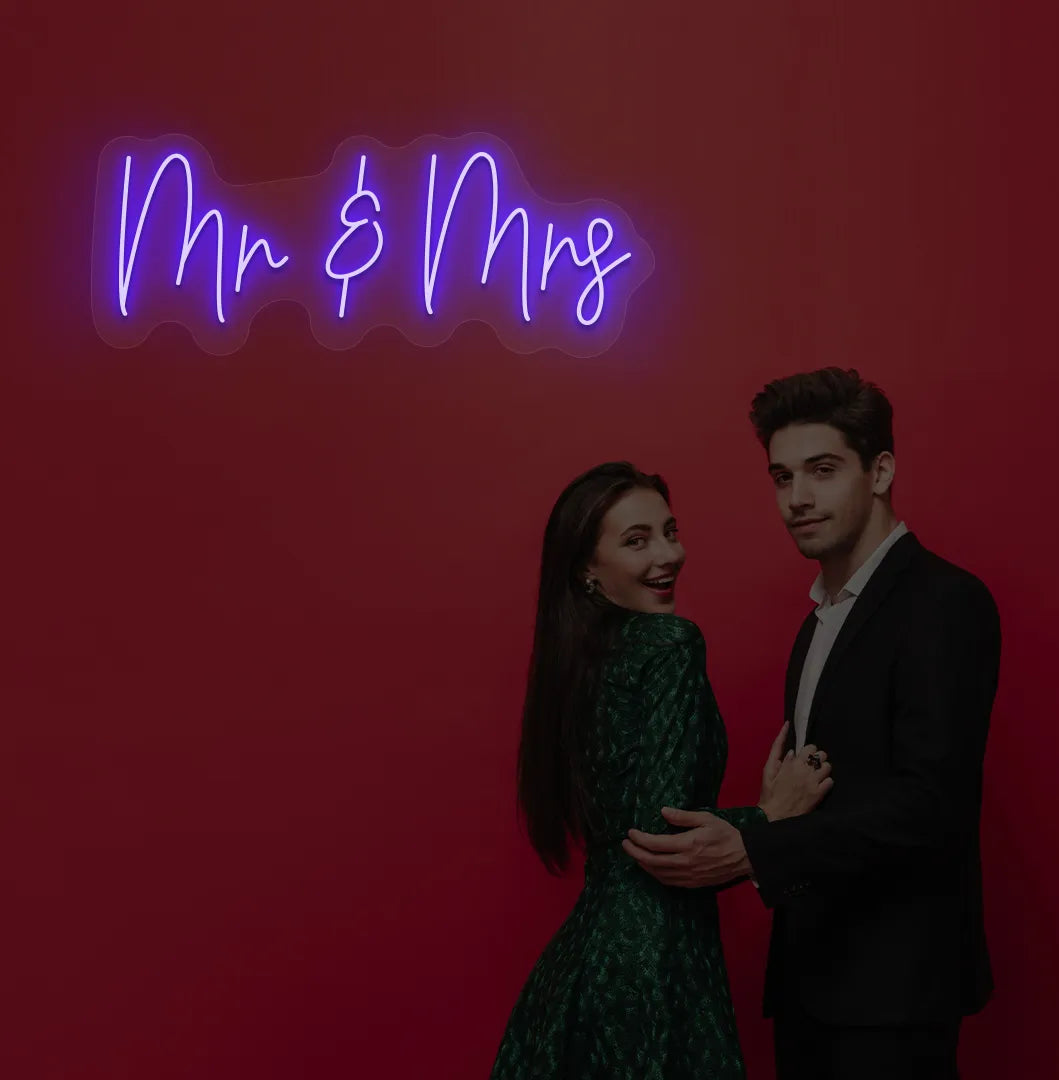 Image of a stylish Mr and Mrs wedding neon sign mounted on aesthetic wall in blue color.