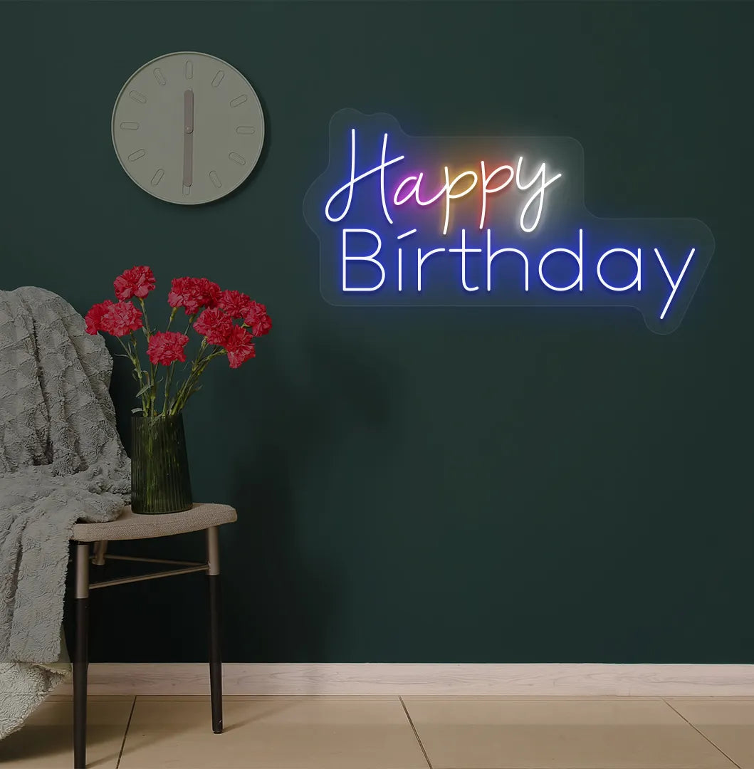 Image of a stylish multicolor Happy Birthday neon sign mounted on modern wall in blue color.