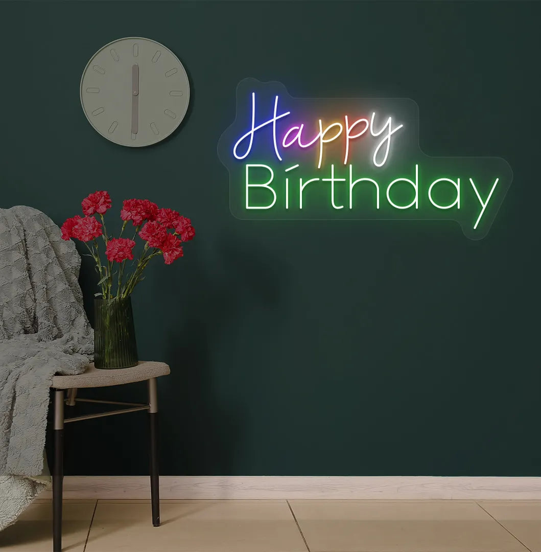 Trendy multicolor Happy Birthday neon sign mounted on party backdrop wall in green color.
